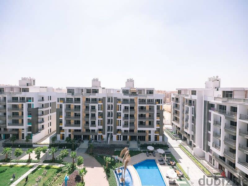 Apartment with garden for sale in Fifth Settlement, Golden Square, in icon Compound, with only 15% down payment 30% cash DIS | view of the landscape 7