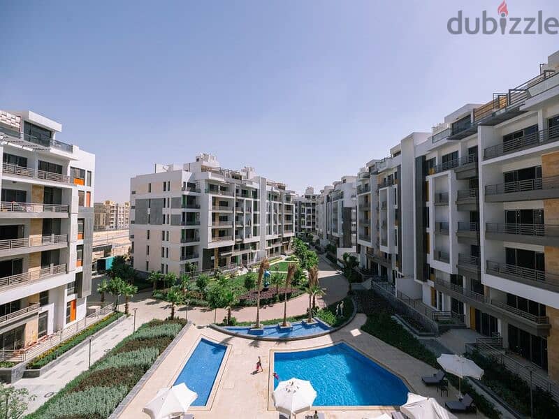 Apartment with garden for sale in Fifth Settlement, Golden Square, in icon Compound, with only 15% down payment 30% cash DIS | view of the landscape 15