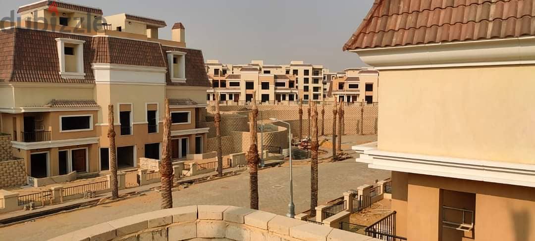S villa for sale in Sarai Compound, New Cairo, corner 239 m, on the Suez Road directly next to Madinaty and Mountain View, 120% discount installments 14