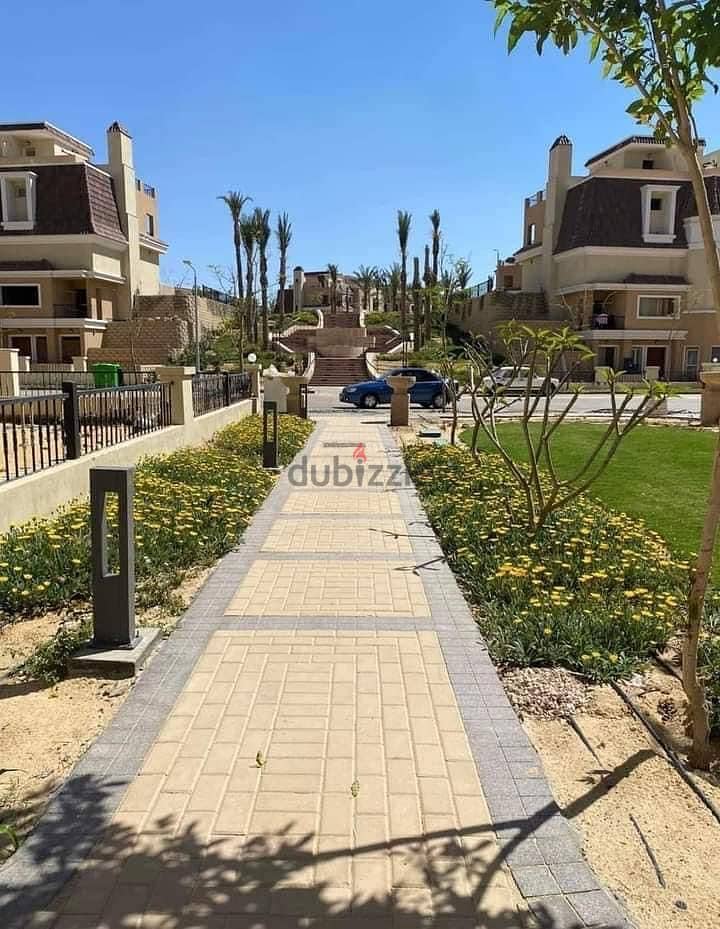 S villa for sale in Sarai Compound, New Cairo, corner 239 m, on the Suez Road directly next to Madinaty and Mountain View, 120% discount installments 21