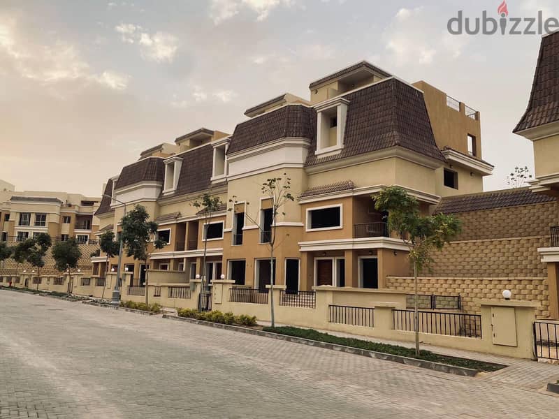 S villa for sale in Sarai Compound, New Cairo, corner 239 m, on the Suez Road directly next to Madinaty and Mountain View, 120% discount installments 23