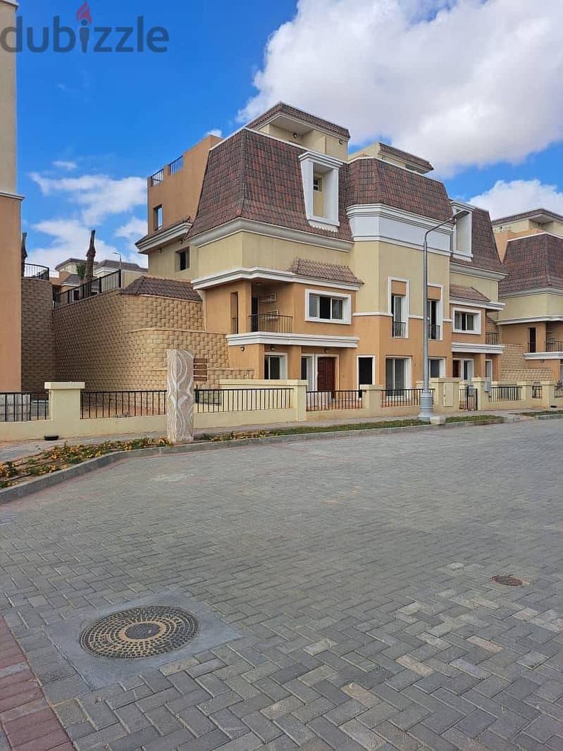 S villa for sale in Sarai Compound, New Cairo, corner 239 m, on the Suez Road directly next to Madinaty and Mountain View, 120% discount installments 26