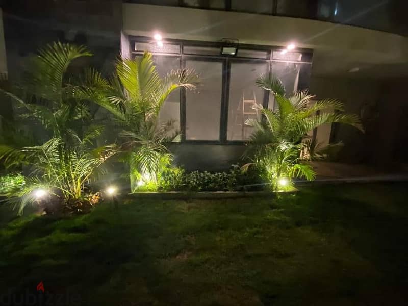 apartment with private garden for sale in Taj City Compound, Fifth Settlement, in a very special location and at the best price in New Cairo. 1