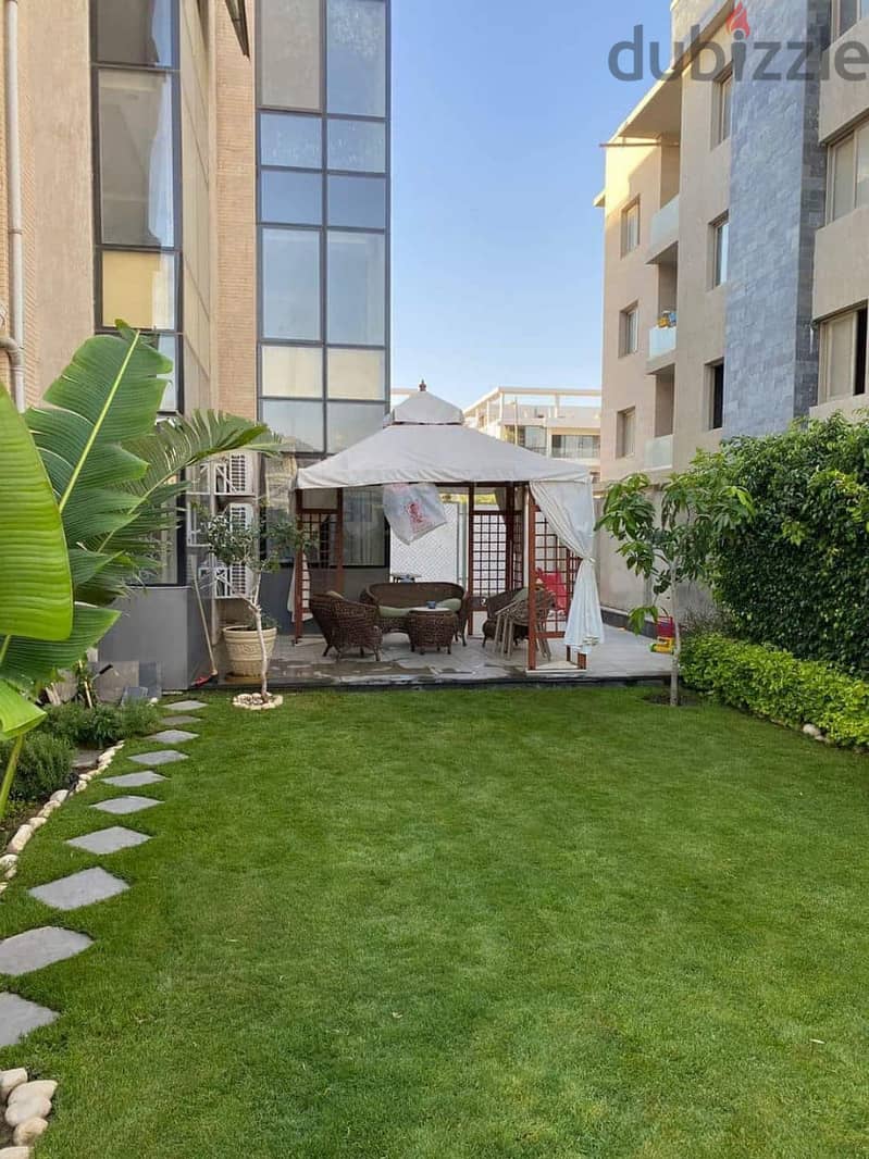 apartment with private garden for sale in Taj City Compound, Fifth Settlement, in a very special location and at the best price in New Cairo. 2