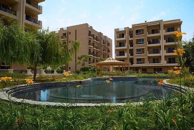 Ground floor apartment with garden for sale in an excellent location in New Cairo on the Suez Road directly in front of Cairo Airport taj city 2