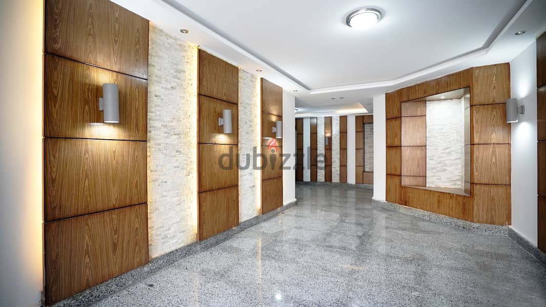 Apartment for sale in 6th of October, with a down payment of 200,000 and installments over 8 years, half finished, in a full-service compound 1