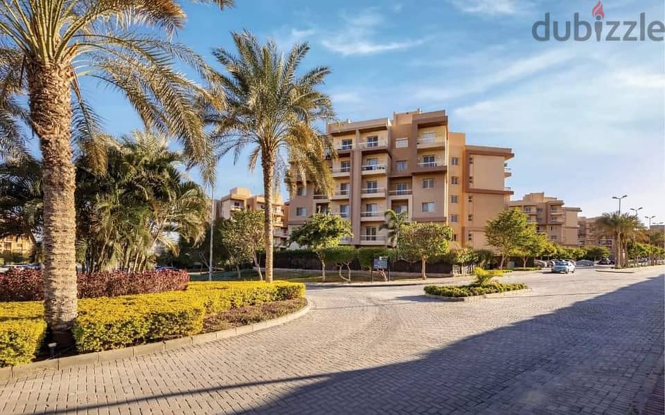 Apartment for sale in 6th of October, with a down payment of 200,000 and installments over 8 years, half finished, in a full-service compound 2