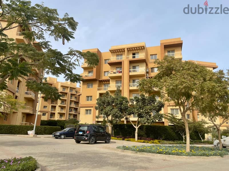 Apartment for sale in 6th of October, with a down payment of 200,000 and installments over 8 years, half finished, in a full-service compound 10