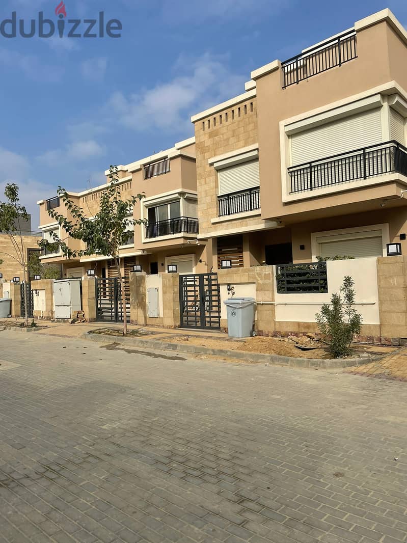 Villa for sale with garden, in installments, on a very special view, on the landscape, in front of Cairo Airport, in the Taj City compound. 2