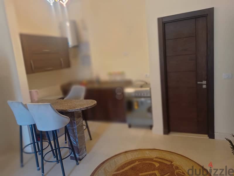 For rent fully finished and furnished with AC`S, kitchen and applicance studio in 90 Avenue New Cairo - 90 أفينيو التجمع الخامس 8