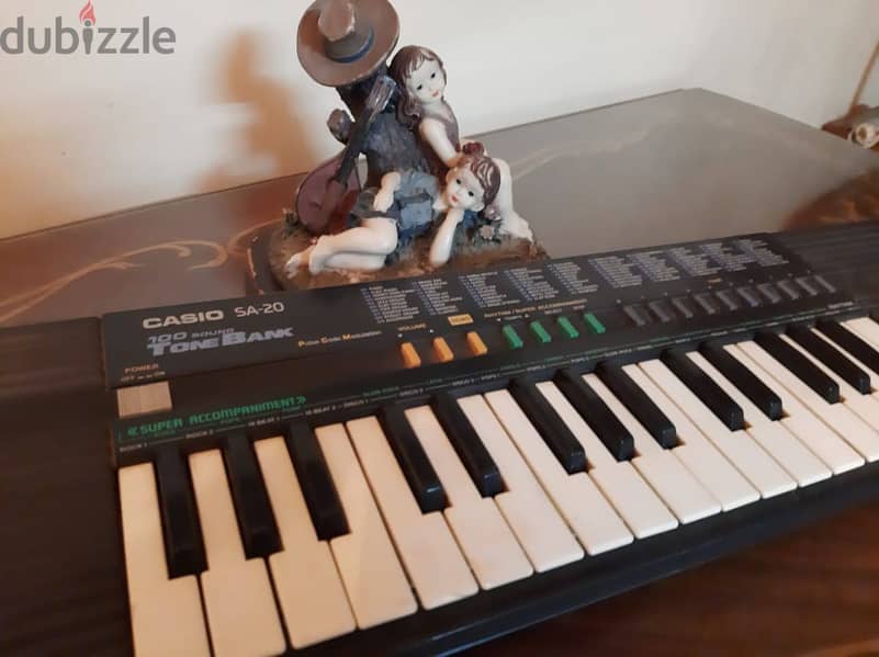 أورج CASIO كوري أصلي أكثر من 100 ايقاع وأله موسيقية مدمجة . 32 مفتاح 11