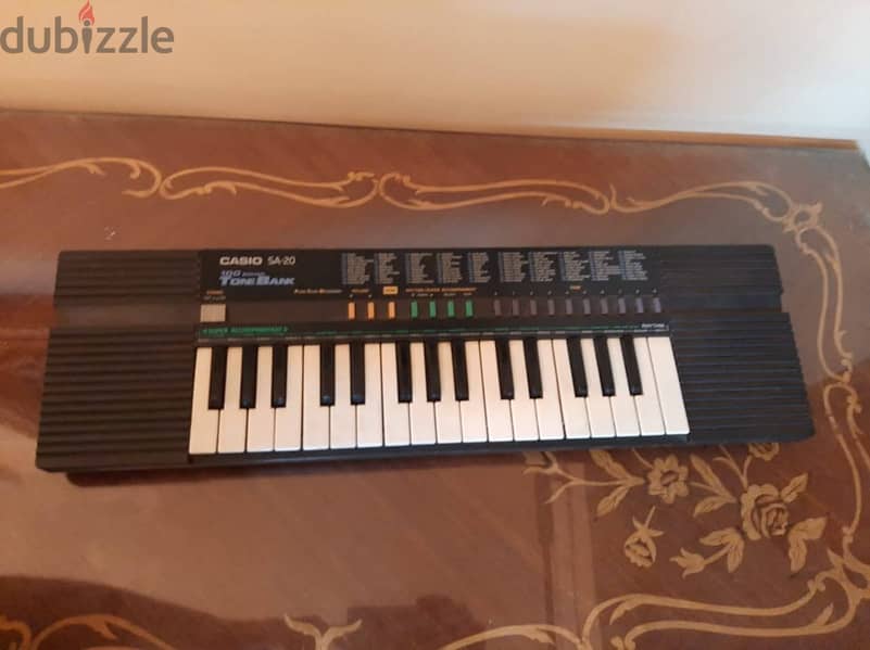 أورج CASIO كوري أصلي أكثر من 100 ايقاع وأله موسيقية مدمجة . 32 مفتاح 2