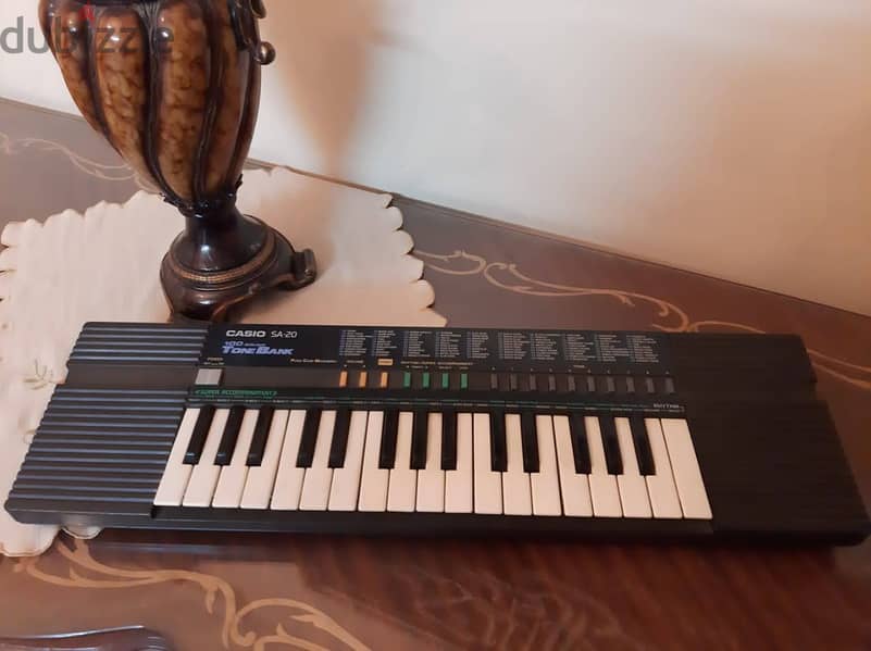 أورج CASIO كوري أصلي أكثر من 100 ايقاع وأله موسيقية مدمجة . 32 مفتاح 9