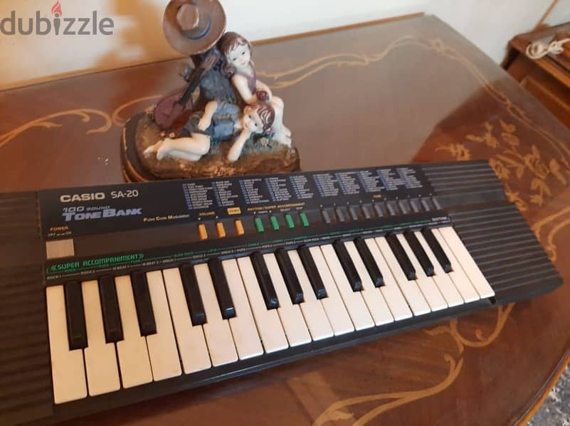 أورج CASIO كوري أصلي أكثر من 100 ايقاع وأله موسيقية مدمجة . 32 مفتاح 12