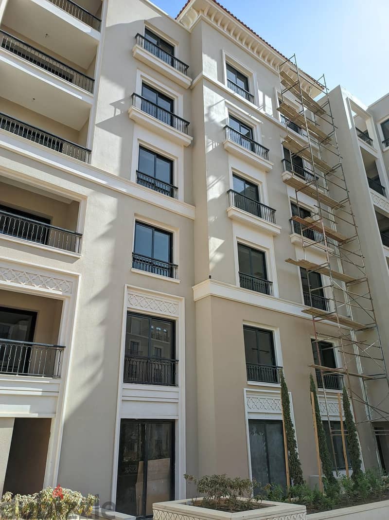 For sale, an apartment with a finished garden, with air conditioners, in the best location in Sheikh Zayed, next to Hyper One, in the Village West Com 4