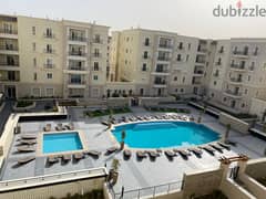 Apartment for rent in Mivida Compound in a prime location overlooking a swimming pool ( 2 BED WITH A/C & KITCHEN ) شقه بالتكيفات و المطبخ للايجار