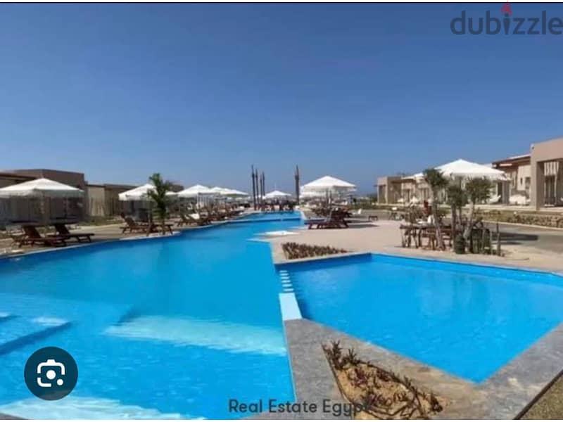 FOR SALE IN GAIA AL Ahly Sabbour  ( Ras El Hekma ) prime location overlooking pools and sea view 22