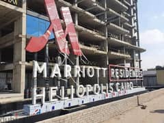 Only with a down payment of 880 thousand I own a hotel apartment ((with Marriott Hotel services)) finished with air conditioners & garage on Suez road