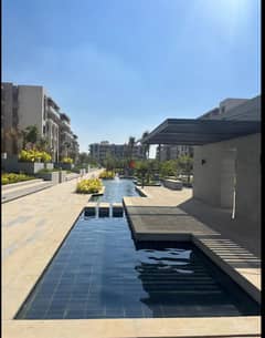 Apartment 160. M with garden 110. M in The Address East New Cairo fully finished for sale with kitchen and dressing ready to move with down payment and