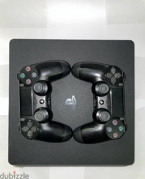 PlayStation 4 slim 1tb كسر زيرو معاه دراعين اوريجينال و ستاند 1