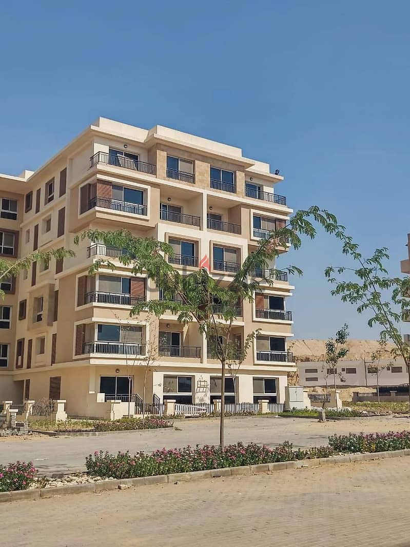 Apartment for sale in the Fifth Settlement in Taj City Compound, in interest-free installments, with a distinctive view with a landscape view 18