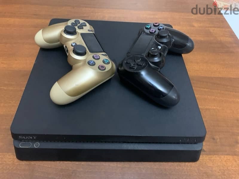 PS4 slim like new with 2 original controllers 0