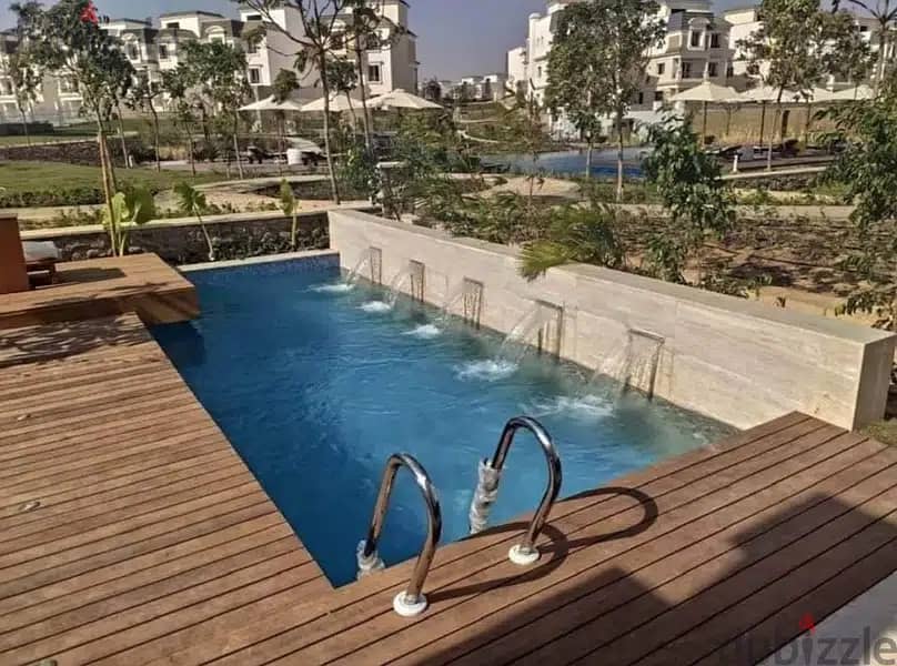 Garden apartment for sale in 6th of october in | Mountain View Icity October | in Boulevard Axis directly on laggon view with a prime location 7