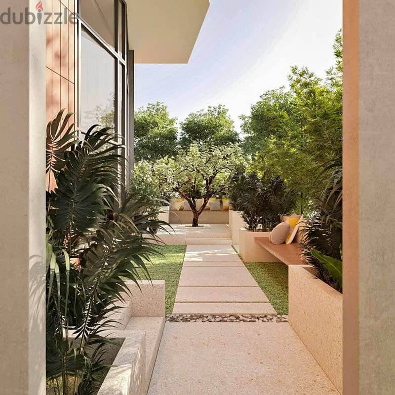 With the old price | Apartment with garden with 5% down payment in Taj City, in front of the airport, with a distinctive view. 4