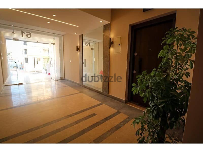 Apartment for sale with private garden, fully finished, with air conditioners, with the largest open view and landscape, with one parking slot 10