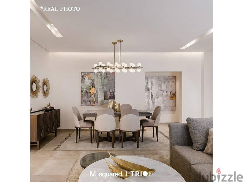 Apartment with garden for sale in Trio Garden, with a 10% down payment, luxurious finishing, installments for 8 years, in the heart of the Fifth Settl 1