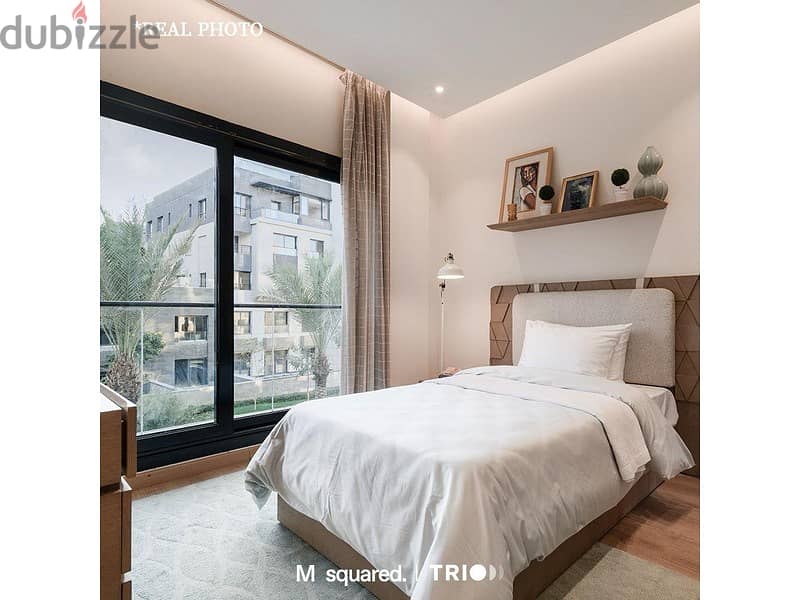 Apartment with garden for sale in Trio Garden, with a 10% down payment, luxurious finishing, installments for 8 years, in the heart of the Fifth Settl 4