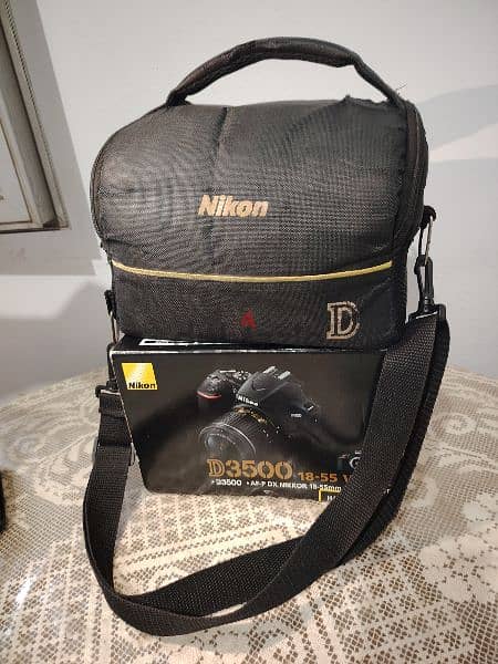 Nikon D3500 كاميرا نيكون بكل حاجتها و لينس وفلاش اضافيين 0