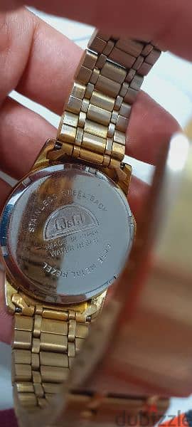 Unisex Golden Original Q&Q watch used in a good condition for sale 1