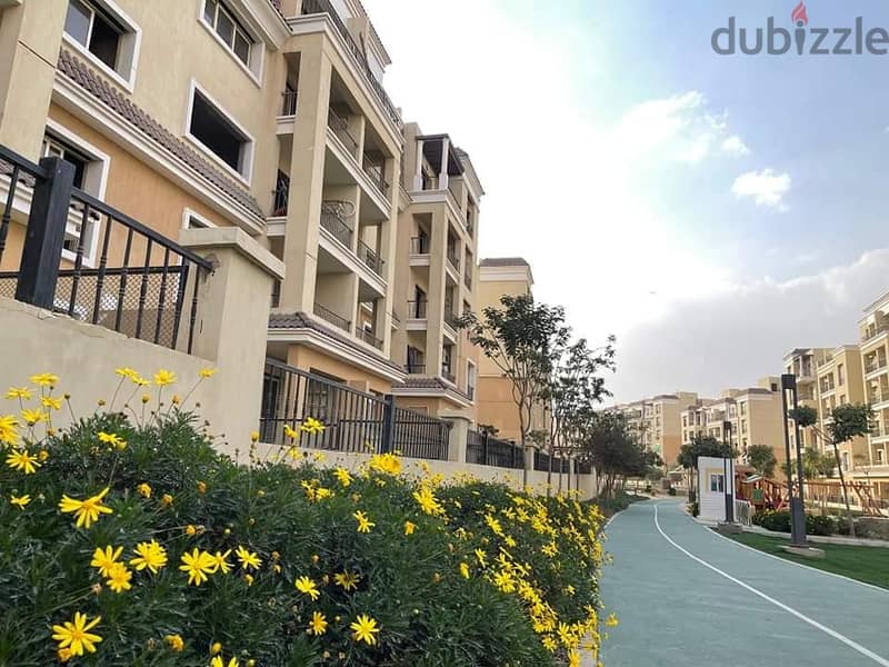 Apartment for sale directly in front of Madinaty, only  down payment and the rest in installments , view on garden 1