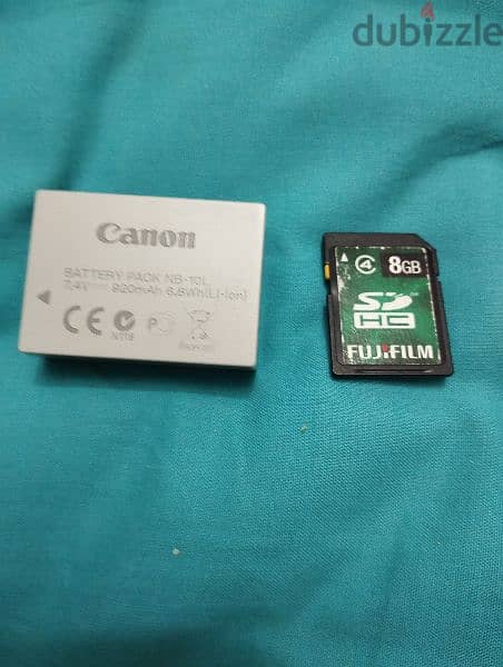 canon camera with battery 8 gb memory card and battery charger 1