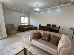 For rent, fully finished and furnished with AC`S, kitchen, and kitchen appliances apartment, Prime Location front AUC ,New Cairo - النرجس التجمع 0