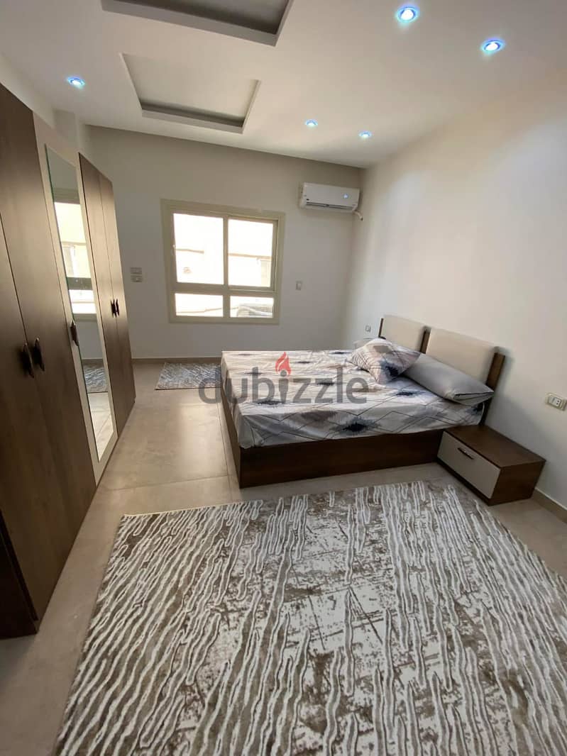 For rent, fully finished and furnished with AC`S, kitchen, and kitchen appliances apartment, Prime Location front AUC ,New Cairo - النرجس التجمع 1
