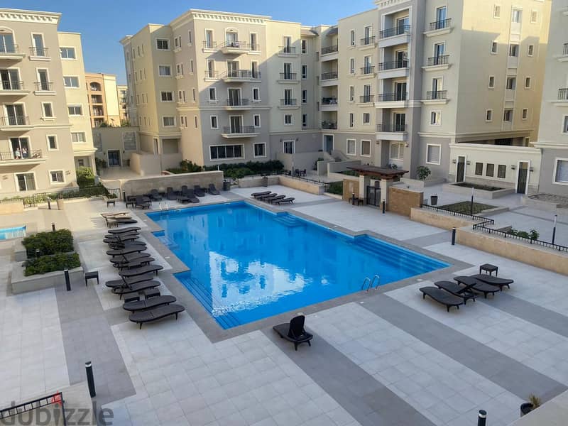 Furnished apartment for rent in Mivida Compound overlooking a swimming pool - Emaar - next to the American University 0