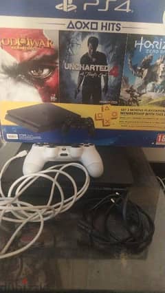 ps4 Slim 500gb with his box and 1 controller and 2 games for sale