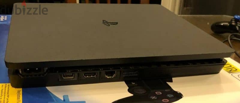 ps4 slim 1tb with original controller and an uncharted 4 CD 1