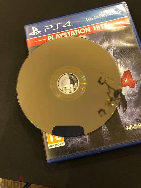 ps4 slim 1tb with original controller and an uncharted 4 CD 9