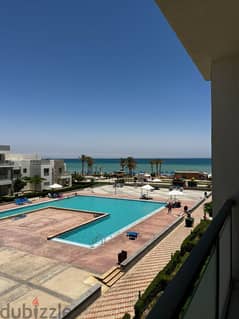 At the old price, a chalet for sale, finished and furnished, overlooking the sea and the pool, in Aroma Bay, Ain Sokhna. Chalet for sale, finished, on