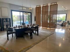 A snapshot apartment for sale, fully finished, with the lowest down payment and price, in Swan Lake West Compound, Sheikh Zayed