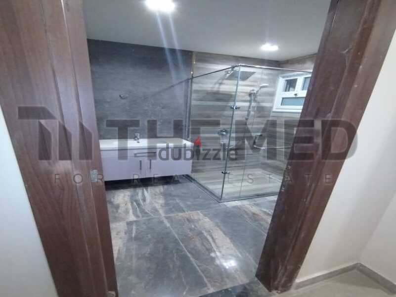 Apartment for sale with open view, ready to move, in the Ninth District, Sheikh Zayed 11