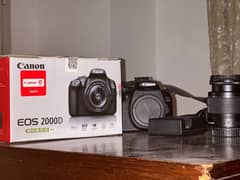 canon 2000D like new. stil in warranty+kit lens+32GB Card