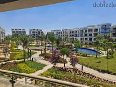 Ground floor apartment for sale with a private garden on an open view in One 16 Sheikh Zayed Compound