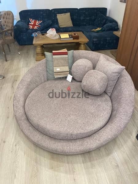 Comfortable circular couch by Walnut Furniture. 0