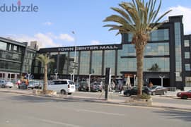 A commercial store in Town Center Mall in front of Green Hills Club