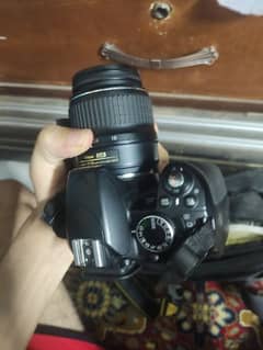 Nikon D3100 with lens nikon 18:55