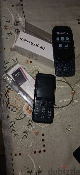 mobile phone Nokia 5310 Used=٧٠٠.  + mobile phone Nokia 6310 used=٧٠٠ 0